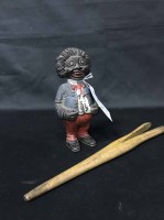 Lot 47 - COLD PAINTED NOVELTY MONEY BANK AND A GLOVE...