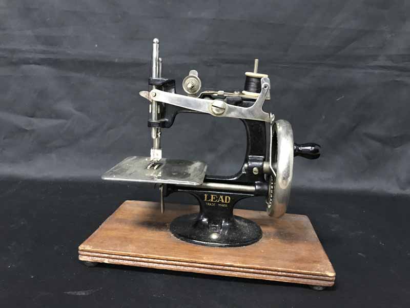 Lot 63 MINIATURE LEAD SEWING MACHINE
