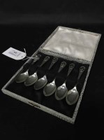 Lot 353 - CASE SET OF SIX SILVER SPOONS with crossed...