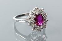 Lot 1740 - FINE RUBY AND DIAMOND CLUSTER RING the central...
