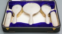 Lot 395 - GEORGE V SILVER VANITY SET maker Walker & Hall,...