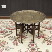 Lot 347 - LARGE ISLAMIC BRASS CIRCULAR TABLE ON FOLDING...