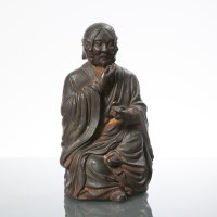 Lot 802 - CHINESE THREE FACED IRON BUDDHA the seated...