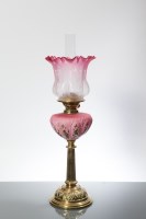 Lot 810 - VICTORIAN BRASS OIL LAMP WITH CRANBERRY GLASS...
