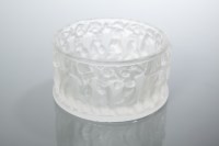 Lot 515 - LALIQUE CIRCULAR BOWL moulded with putti in a...