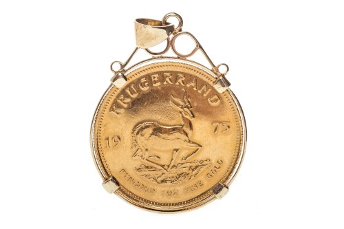Lot 524 - GOLD KRUGERRAND DATED 1975 mounted in a nine...