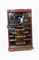 Lot 263 - CHINESE HARDWOOD GLAZED CABINET with interior...