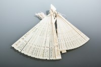 Lot 274 - TWO CHINESE IVORY FANS with pierced sticks,...