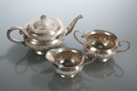 Lot 297 - INDIAN WHITE METAL THREE PIECE TEA SERVICE...