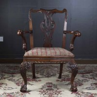 Lot 868 - MAHOGANY OPEN ELBOW CHAIR of high Chippendale...