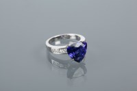 Lot 1641 - TANZANITE AND DIAMOND DRESS RING the central...