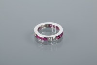 Lot 1649 - RUBY AND DIAMOND ETERNITY RING with square cut...
