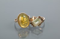 Lot 1659 - TWO GOLD GEM SET RINGS on with an amber...