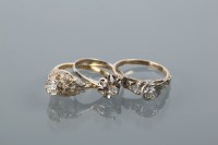 Lot 1670 - GROUP OF THREE DIAMOND SOLITAIRE RINGS two...