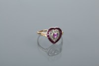 Lot 1685 - HEART SHAPED RUBY AND DIAMOND RING set with a...