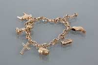 Lot 1688 - GOLD CHARM BRACELET the bracelet marked 750...