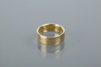 Lot 1691 - EIGHTEEN CARAT GOLD WEDDING BAND with engraved...