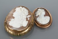 Lot 1695 - TWO CAMEO BROOCHES both depicting women in...