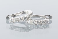Lot 1700A - PAIR OF DIAMOND EARRINGS each set with a row...