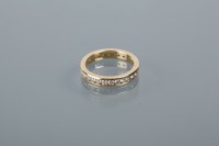 Lot 1728 - DIAMOND FULL ETERNITY RING set with brilliant...
