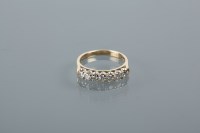 Lot 1731 - DIAMOND HALF ETERNITY RING set with seven...