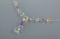 Lot 1783 - MULTI GEM SET NECKLACE set with round, pear...