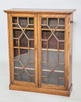 Lot 743 - EARLY 20TH CENTURY OAK GLAZED BOOKCASE with...