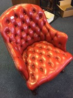 Lot 935 - RED BUTTON BACKED ARMCHAIR with ball and claw...