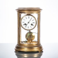 Lot 525 - FRENCH FOUR GLASS OVAL BRASS MANTEL CLOCK the...