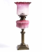 Lot 964 - VICTORIAN BRASS OIL LAMP WITH CRANBERRY GLASS...
