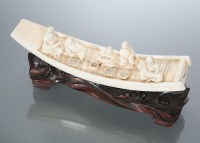 Lot 270 - CHINESE IVORY CARVING of figures seated on a...