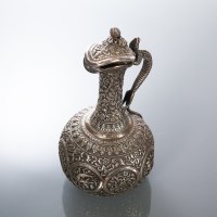 Lot 277 - BURMESE SILVER EMBOSSED EWER with lizard...