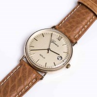 Lot 719 - GENTLEMAN'S NINE CARAT GOLD GENEVE WRISTWATCH...