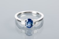 Lot 1627A - SAPPHIRE AND DIAMOND THREE STONE RING set with...