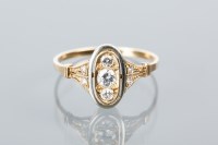 Lot 1640 - ART DECO DIAMOND RING the oval bezel set with...