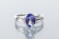 Lot 1645 - TANZANITE AND DIAMOND DRESS RING the central...