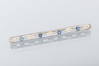 Lot 1646 - ART DECO SAPPHIRE AND SEED PEARL BAR BROOCH...
