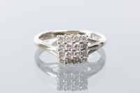 Lot 1652 - DIAMOND DRESS RING the square bezel set with...