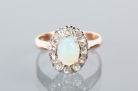 Lot 1654A - OPAL AND DIAMOND CLUSTER RING with a central...