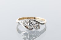 Lot 1657 - DIAMOND THREE STONE RING set with three...