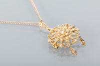 Lot 1658 - VICTORIAN PEARL PENDANT of scrolling openwork...
