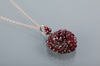 Lot 1661A - EARLY TWENTIETH CENTURY GARNET PENDANT formed...