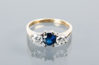 Lot 1665 - SAPPHIRE AND DIAMOND THREE STONE RING set with...