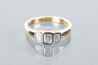 Lot 1672 - DIAMOND THREE STONE RING set with three...