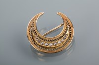 Lot 1681 - PEARL SET CRESCENT BROOCH of pierced design,...