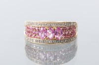 Lot 1687 - PINK SAPPHIRE AND DIAMOND DRESS RING set with...