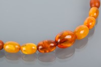 Lot 1687A - MID TWENTIETH CENTURY GRADUATED AMBER BEAD...