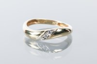 Lot 1689 - DIAMOND SET BAND diagonally set with three...