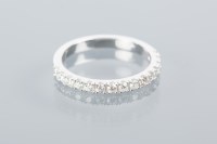 Lot 1689A - DIAMOND HALF ETERNITY RING set with a row of...