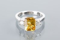 Lot 1694A - YELLOW SAPPHIRE AND DIAMOND THREE STONE RING...